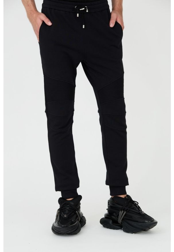 Balmain - BALMAIN Czarne męskie spodnie dresowe Ribbed Flock Sweatpants, Rozmiar L. Kolor: czarny. Materiał: dresówka
