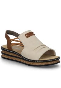 Komfortowe sandały damskie na koturnie beżowe Rieker 62962-60. Kolor: beżowy. Materiał: skóra ekologiczna. Obcas: na koturnie #1