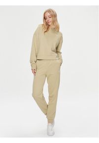 Puma Dres Loungewear 676089 Beżowy Relaxed Fit. Kolor: beżowy. Materiał: dresówka, bawełna