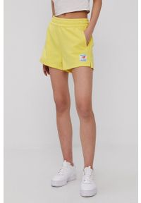 New Balance Szorty WS11504FTL damskie kolor żółty gładkie high waist. Okazja: na co dzień. Stan: podwyższony. Kolor: żółty. Wzór: gładki. Styl: casual