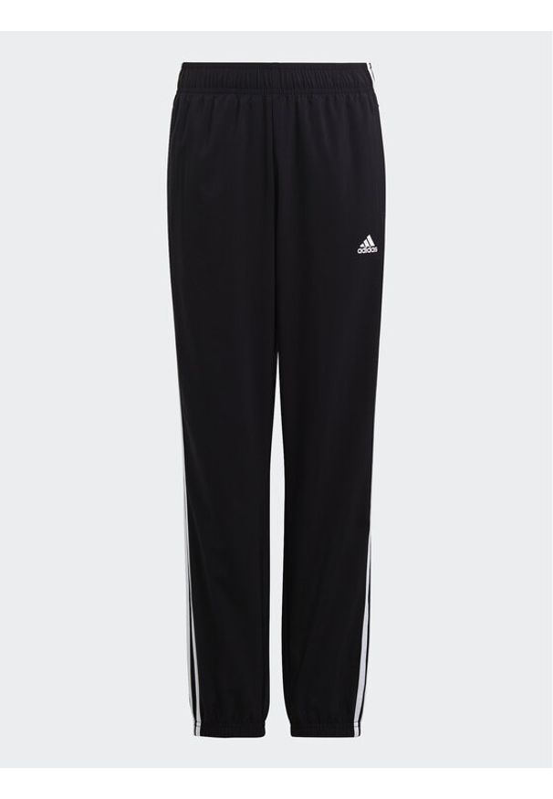 Adidas - adidas Spodnie dresowe Essentials 3-Stripes Woven Tracksuit Bottoms HR6334 Czarny Slim Fit. Kolor: czarny. Materiał: syntetyk