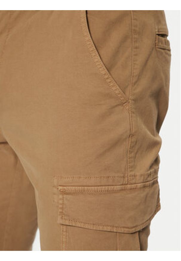 Tommy Jeans Spodnie materiałowe Austin DM0DM20281 Beżowy Regular Fit. Kolor: beżowy. Materiał: bawełna