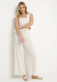 Born2be - Jasnobeżowe Szerokie Spodnie Typu Palazzo z Wysokim Stanem i Wiązaniem Sonalissa. Okazja: na co dzień. Stan: podwyższony. Kolor: beżowy. Styl: boho, casual #7