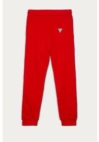 Guess Jeans - Spodnie dziecięce 116-175. Kolor: czerwony. Materiał: bawełna, jeans, dzianina. Wzór: aplikacja #2