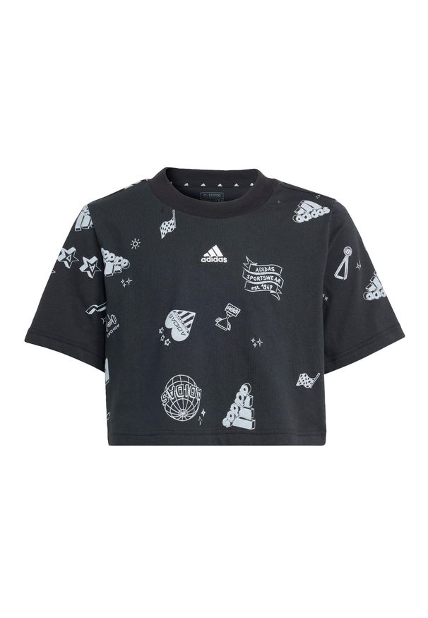 Adidas - Koszulka Brand Love Allover Print Crop Kids. Kolor: biały, wielokolorowy, czarny. Materiał: dresówka. Wzór: nadruk