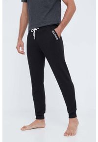 TOMMY HILFIGER - Tommy Hilfiger spodnie piżamowe bawełniane kolor czarny gładka. Kolor: czarny. Materiał: bawełna. Wzór: gładki