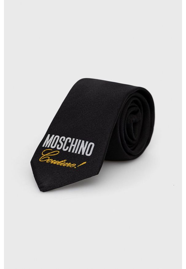 MOSCHINO - Moschino Krawat kolor czarny. Kolor: czarny. Materiał: materiał. Wzór: gładki
