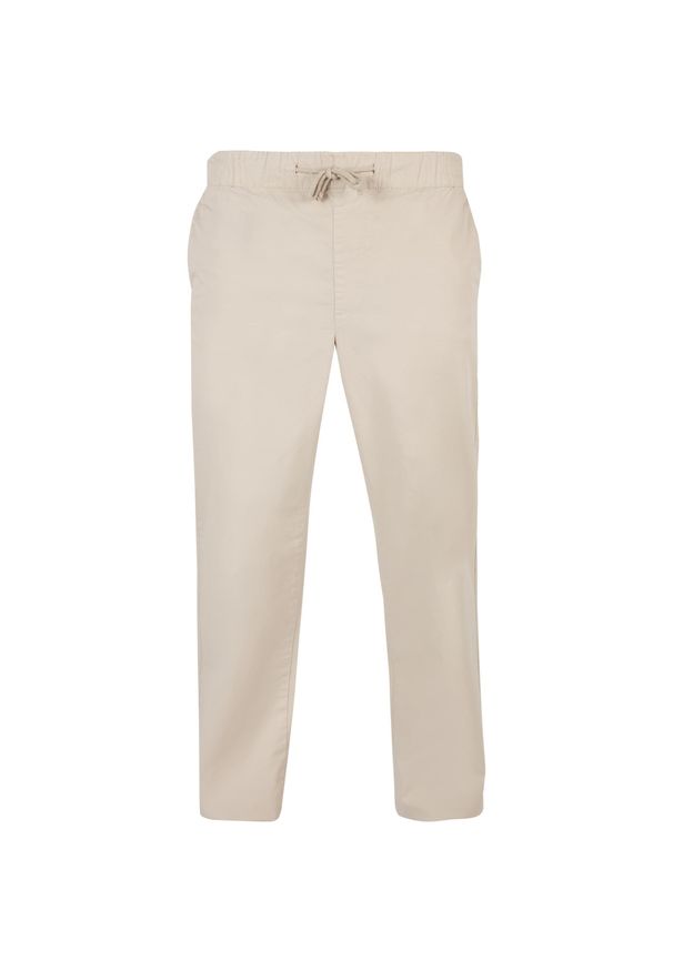 Spodnie z prostymi nogawkami z rozcięciem Urban Classics. Kolor: beżowy