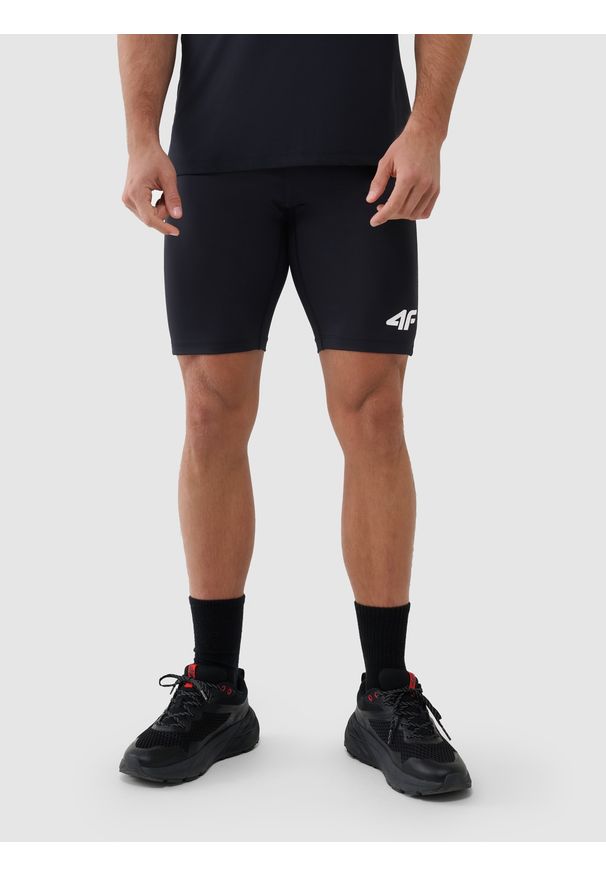 4f - 4F Legginsy krótkie treningowe męskie - czarne S. Kolor: czarny. Materiał: dzianina, włókno, syntetyk, materiał, elastan. Wzór: gładki, ze splotem, jednolity. Sport: fitness