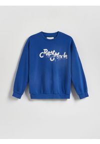 Reserved - Bluza oversize z nadrukiem - niebieski. Kolor: niebieski. Materiał: dzianina, bawełna. Wzór: nadruk #1