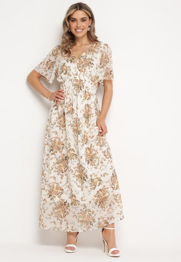 Born2be - Beżowa Rozkloszowana Sukienka z Krótkim Rękawem i Gumką w Pasie Wiązana na Plecach Jolla. Kolor: beżowy. Długość rękawa: krótki rękaw. Styl: klasyczny