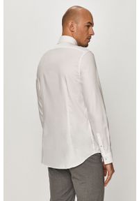 Calvin Klein - Koszula bawełniana. Typ kołnierza: kołnierzyk klasyczny. Kolor: biały. Materiał: bawełna. Długość rękawa: długi rękaw. Długość: długie. Wzór: gładki. Styl: elegancki, klasyczny #3