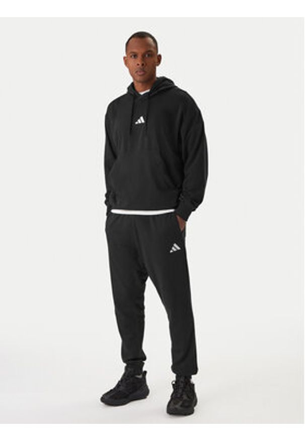 Adidas - adidas Spodnie dresowe Essentials Feel Cozy JE3854 Czarny Regular Fit. Kolor: czarny. Materiał: syntetyk, bawełna