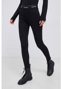 Calvin Klein Legginsy damskie kolor czarny gładkie. Kolor: czarny. Materiał: dzianina, włókno. Wzór: gładki
