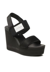 Sandały Calvin Klein Jeans Wedge Sandal Badge YW0YW01028 Black BDS. Kolor: czarny. Materiał: materiał