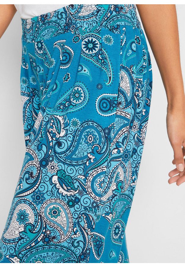 bonprix - Dżersejowe spodnie haremki z lejącej mieszanki wiskozy. Kolor: niebieski. Materiał: jersey, wiskoza. Wzór: nadruk, paisley