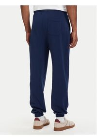TOMMY HILFIGER - Tommy Hilfiger Spodnie dresowe Essential UM0UM03911 Granatowy Relaxed Fit. Kolor: niebieski. Materiał: bawełna #3