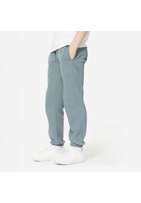 DOMYOS - Spodnie dresowe dla dzieci Domyos. Kolor: zielony. Materiał: poliester, bawełna, materiał. Sport: joga i pilates #1