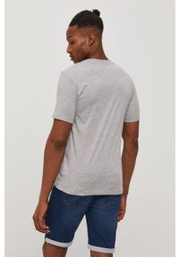 New Balance T-shirt męski kolor szary melanżowy. Okazja: na co dzień. Kolor: szary. Materiał: dzianina. Wzór: melanż. Styl: casual