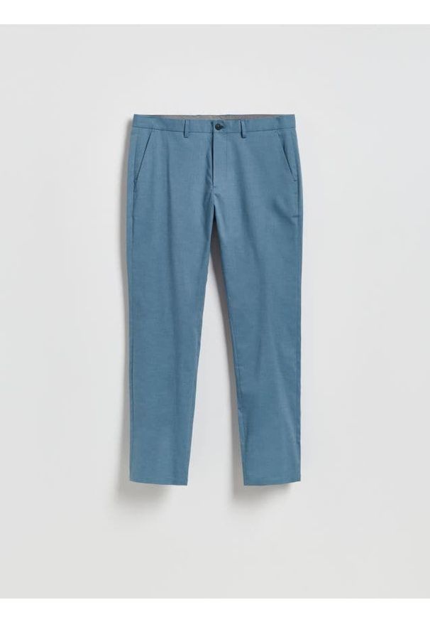 Reserved - Spodnie chino slim fit - granatowy. Kolor: niebieski. Materiał: tkanina, bawełna