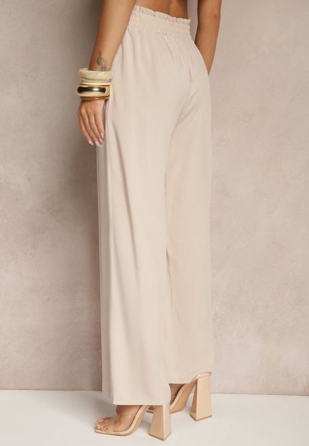 Renee - Beżowe Szerokie Spodnie z Wiskozy Ozdobione Wiązaniem Toleassa. Okazja: na co dzień. Kolor: beżowy. Materiał: wiskoza. Wzór: aplikacja. Styl: casual