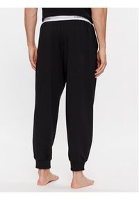 Calvin Klein Underwear Spodnie piżamowe 000NM2302E Czarny Regular Fit. Kolor: czarny. Materiał: syntetyk