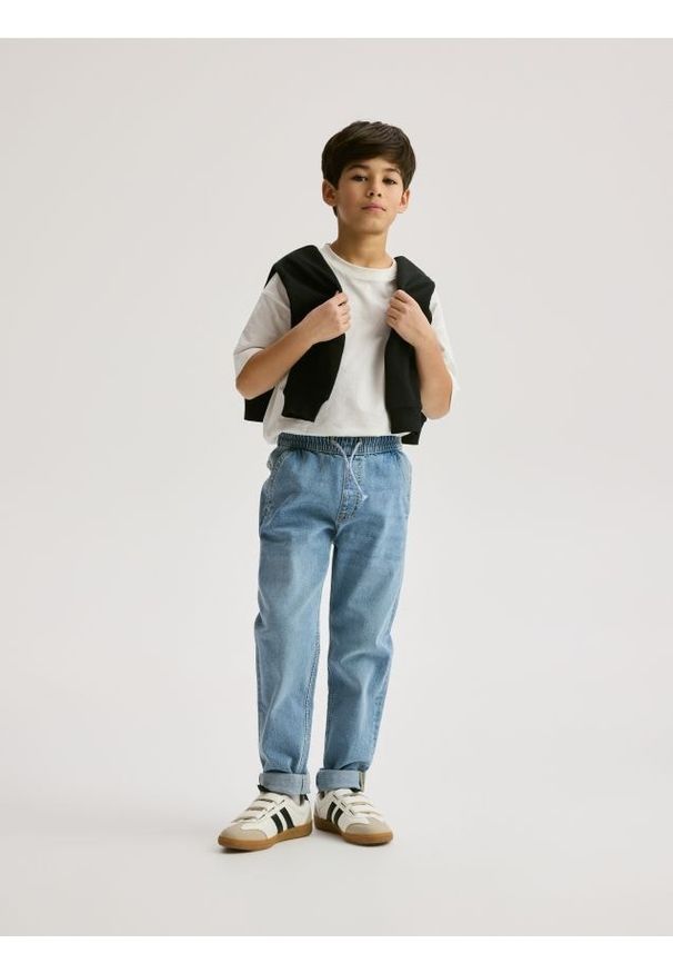 Reserved - Jeansy carrot fit - niebieski. Kolor: niebieski