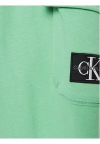 Calvin Klein Jeans Spodnie dresowe Badge Cargo IB0IB01600 Zielony Regular Fit. Kolor: zielony. Materiał: bawełna