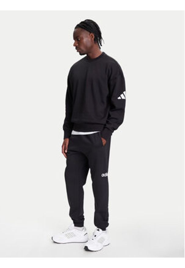 Adidas - adidas Spodnie dresowe Essentials Linear Fleece JN1786 Czarny Regular Fit. Kolor: czarny. Materiał: bawełna