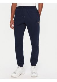 Reebok Spodnie dresowe RK25146CCM Granatowy Regular Fit. Kolor: niebieski. Materiał: syntetyk, bawełna #1