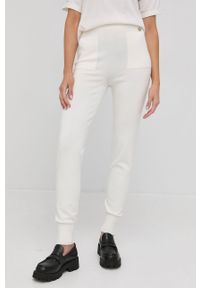 TwinSet - Twinset Spodnie damskie kolor kremowy gładkie. Stan: podwyższony. Kolor: beżowy. Materiał: dzianina. Wzór: gładki