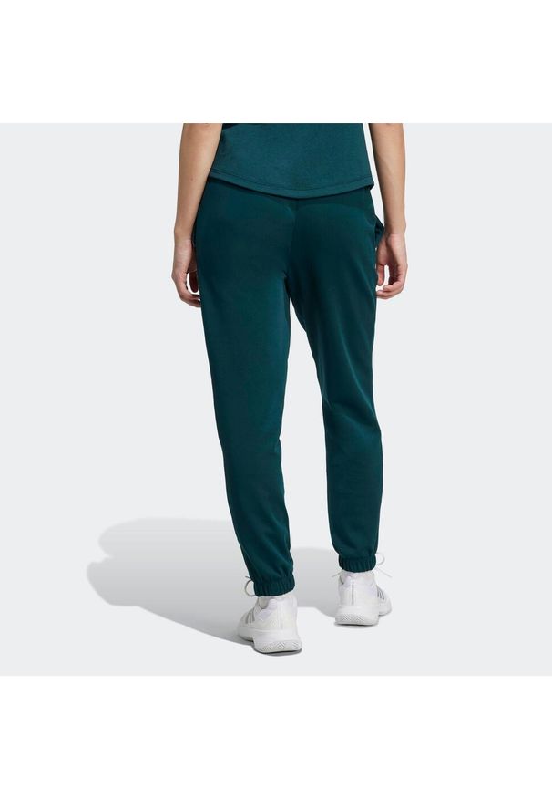 Adidas - Spodnie fitness damskie ADIDAS. Kolor: zielony. Materiał: materiał. Sport: fitness