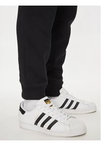 Adidas - adidas Spodnie dresowe Trefoil Essentials IR7798 Czarny Slim Fit. Kolor: czarny. Materiał: bawełna #4