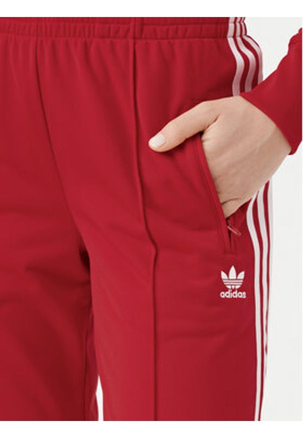 Adidas - adidas Spodnie dresowe adicolor Classics Firebird IR8081 Czerwony Regular Fit. Kolor: czerwony. Materiał: syntetyk