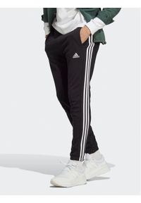 Adidas - adidas Spodnie dresowe Essentials French Terry Tapered Elastic Cuff 3-Stripes Joggers IC0050 Czarny Regular Fit. Kolor: czarny. Materiał: bawełna, dresówka