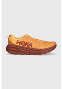 HOKA - Hoka buty RINCON 3 1119395 kolor pomarańczowy 1119395-BOFT. Nosek buta: okrągły. Zapięcie: sznurówki. Kolor: pomarańczowy. Wzór: geometria. Sport: bieganie