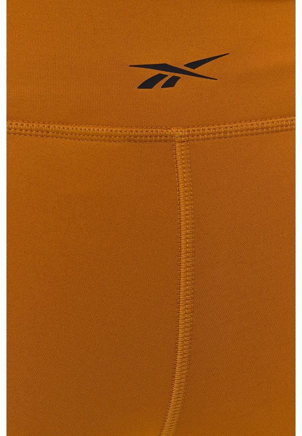 Reebok - Legginsy. Kolor: pomarańczowy. Materiał: dzianina, skóra