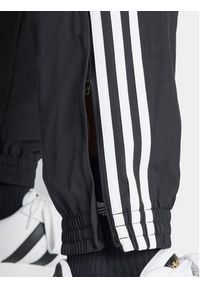 Adidas - adidas Spodnie dresowe Adicolor Woven Firebird IT2501 Czarny Regular Fit. Kolor: czarny. Materiał: syntetyk #3
