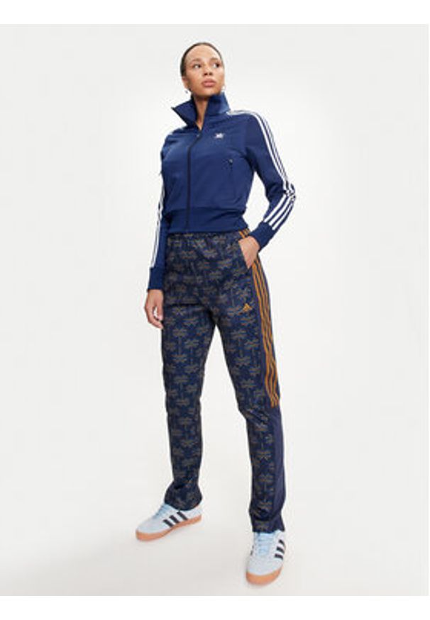 Adidas - adidas Spodnie dresowe FARM Rio Tiro IV9754 Granatowy Regular Fit. Kolor: niebieski. Materiał: bawełna