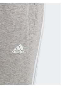 Adidas - adidas Spodnie dresowe Essentials 3-Stripes IC6127 Szary Slim Fit. Kolor: szary. Materiał: bawełna #3