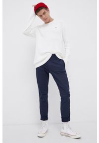 Tommy Jeans Spodnie męskie kolor granatowy dopasowane. Kolor: niebieski. Materiał: tkanina, bawełna