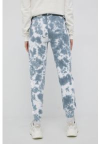 Ellesse spodnie dresowe bawełniane damskie wzorzyste. Kolor: niebieski. Materiał: dresówka, bawełna