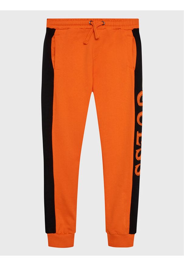 Guess Spodnie dresowe L3RQ24 KA6R3 Pomarańczowy Regular Fit. Kolor: pomarańczowy. Materiał: bawełna