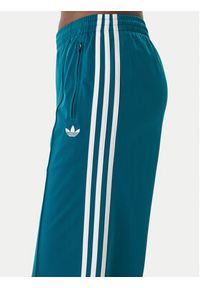 Adidas - adidas Spodnie dresowe Firebird KG3701 Zielony Loose Fit. Kolor: zielony. Materiał: syntetyk #5
