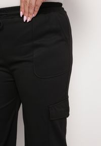 Born2be - Czarne Spodnie z Gumką w Talii z Szerokimi Nogawkami i Dużymi Kieszeniami Ubavia. Kolor: czarny. Materiał: tkanina #6