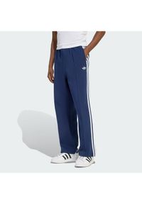 Adidas - adidas Spodnie dresowe adicolor Spacer Track KD4087 Granatowy Baggy Fit. Kolor: niebieski. Materiał: syntetyk. Sport: turystyka piesza #1
