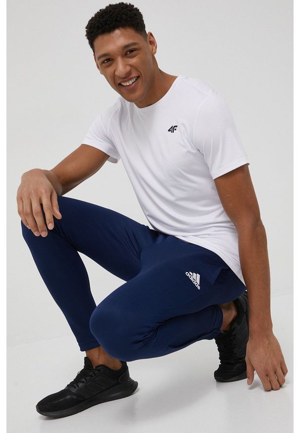 adidas Performance spodnie męskie kolor granatowy proste. Okazja: na co dzień. Kolor: niebieski. Materiał: materiał, dzianina. Wzór: gładki. Styl: casual