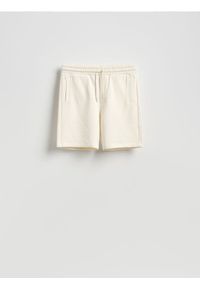 Reserved - Dresowe szorty regular fit - złamana biel. Materiał: dresówka