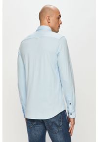Calvin Klein - Koszula bawełniana. Okazja: na co dzień. Typ kołnierza: kołnierzyk klasyczny. Kolor: niebieski. Materiał: bawełna. Długość rękawa: długi rękaw. Długość: długie. Wzór: gładki. Styl: casual, klasyczny #4