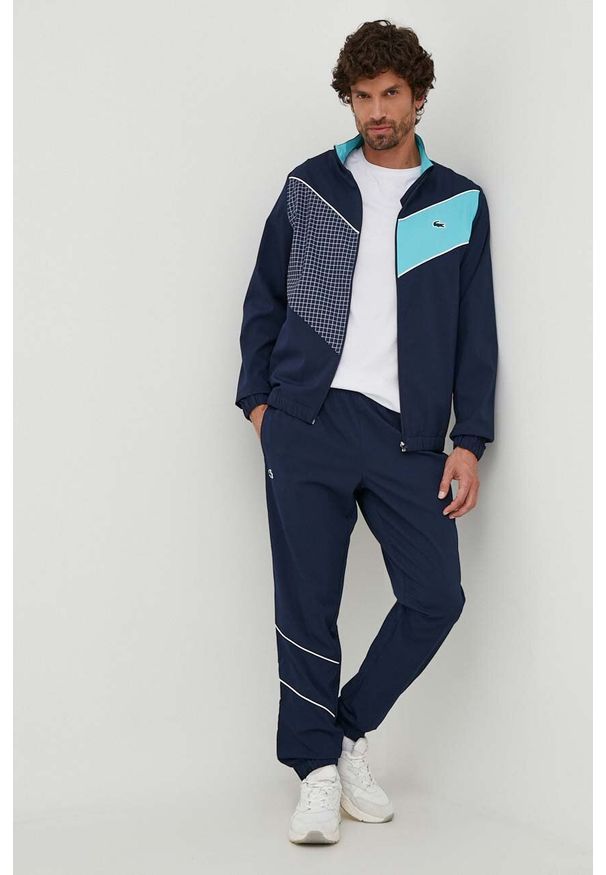 Lacoste dres męski kolor granatowy. Kolor: niebieski. Materiał: dresówka